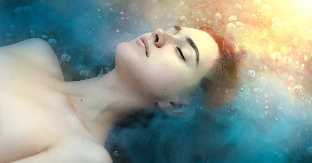 woman with eyes closed in surreal background