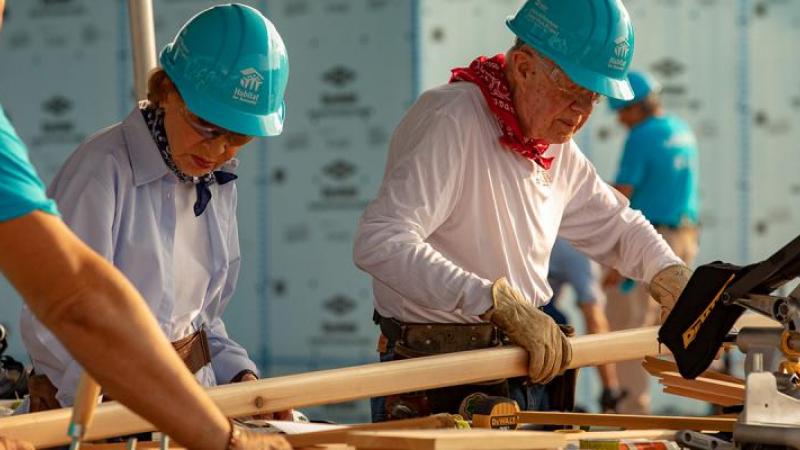 Jimmy Carter building houses with his wife