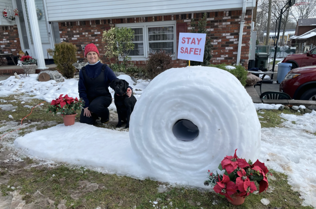 Snow sculpture of giant toilet paper roll