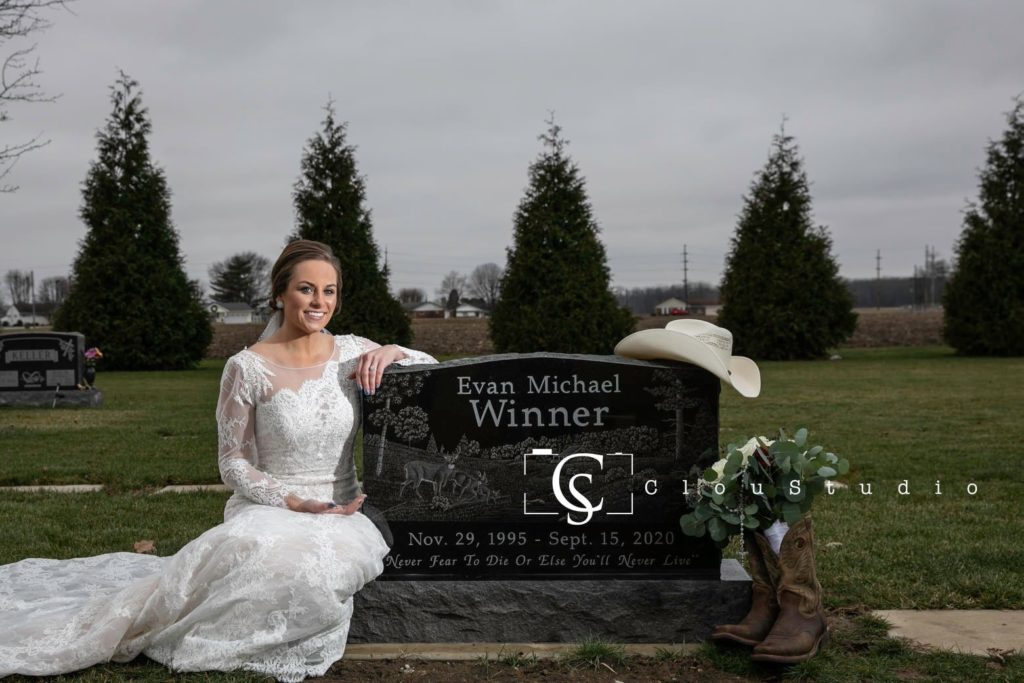 Olivia Kunkler's sitting besides husbands grave. 