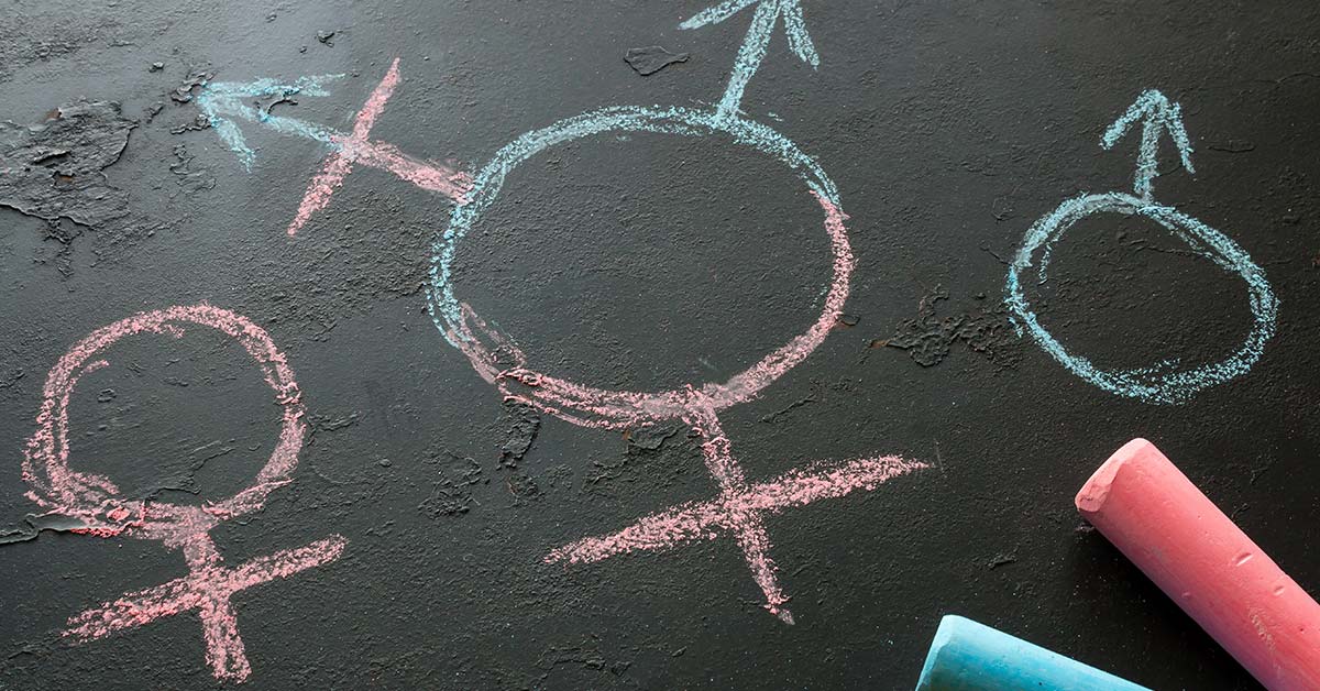 chalk drawings of the male, female, and transgender symbols
