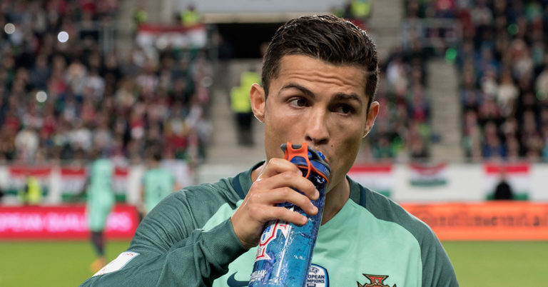 Cristiano Ronaldo Snubs Coca-Cola At Press Conference, Tells Crowd To Drink Water Instead - Featured image