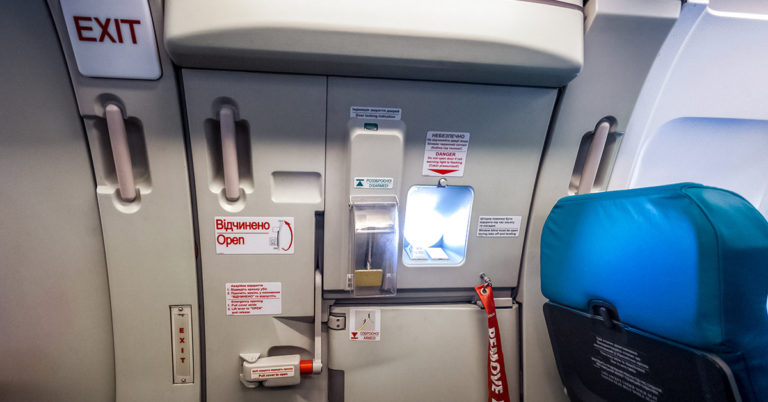 airplane passenger duct taped to seat
