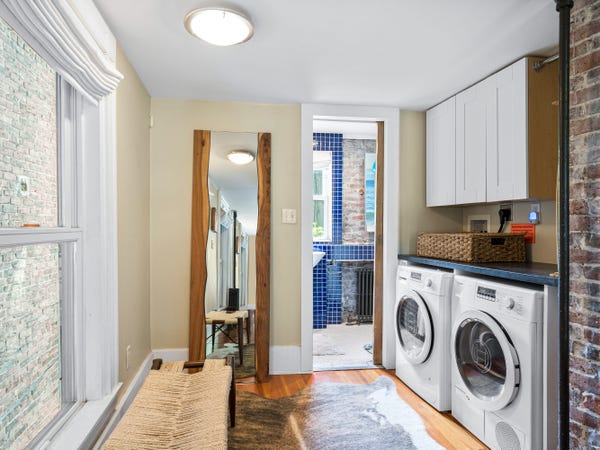 the laundry room and bathroom | CL Properties on Zillow