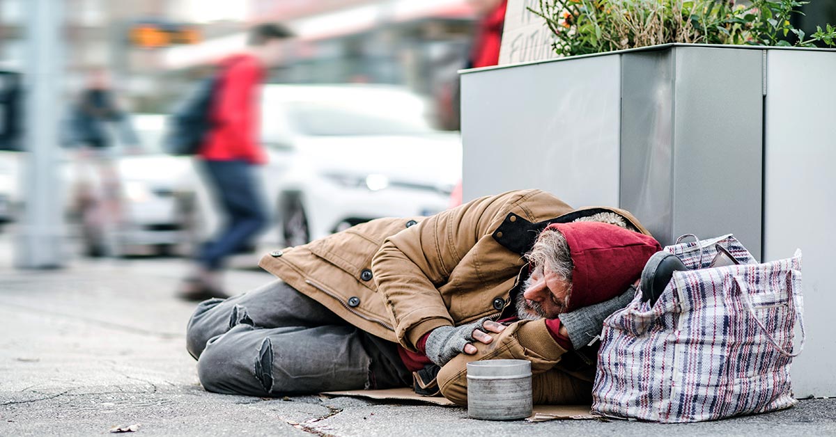 homeless person sleeping on the street