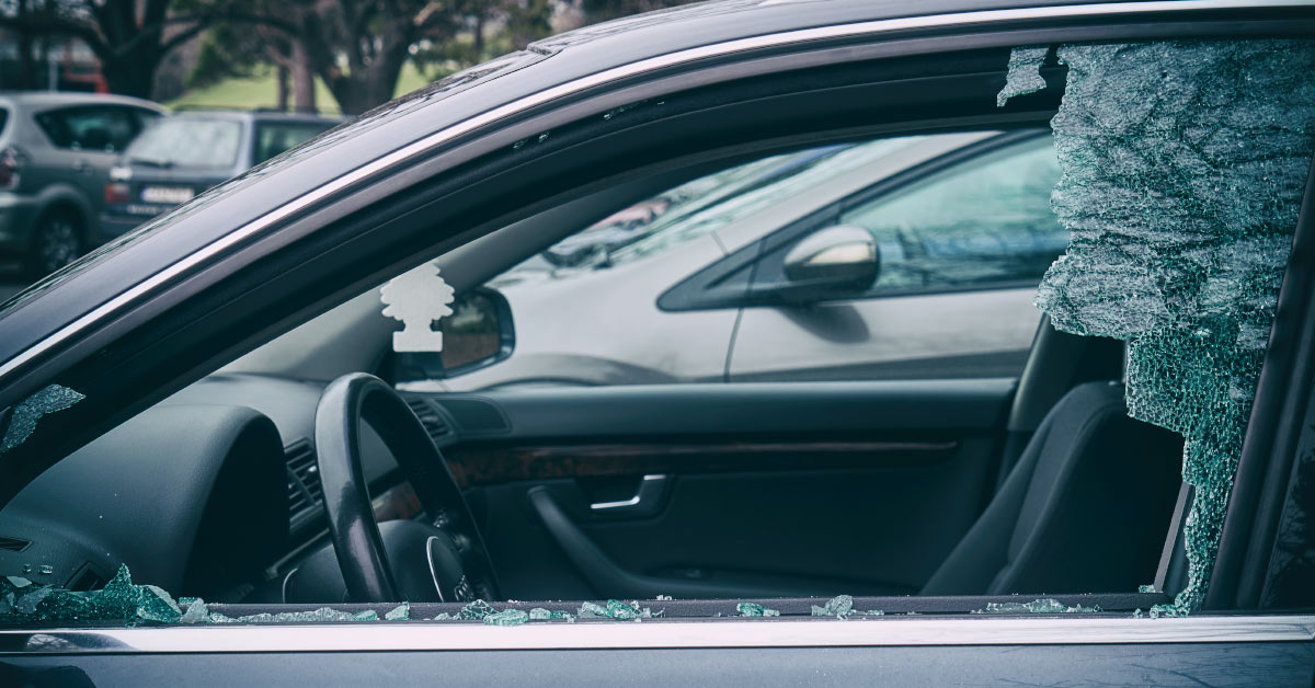 smashed driver side window in a car