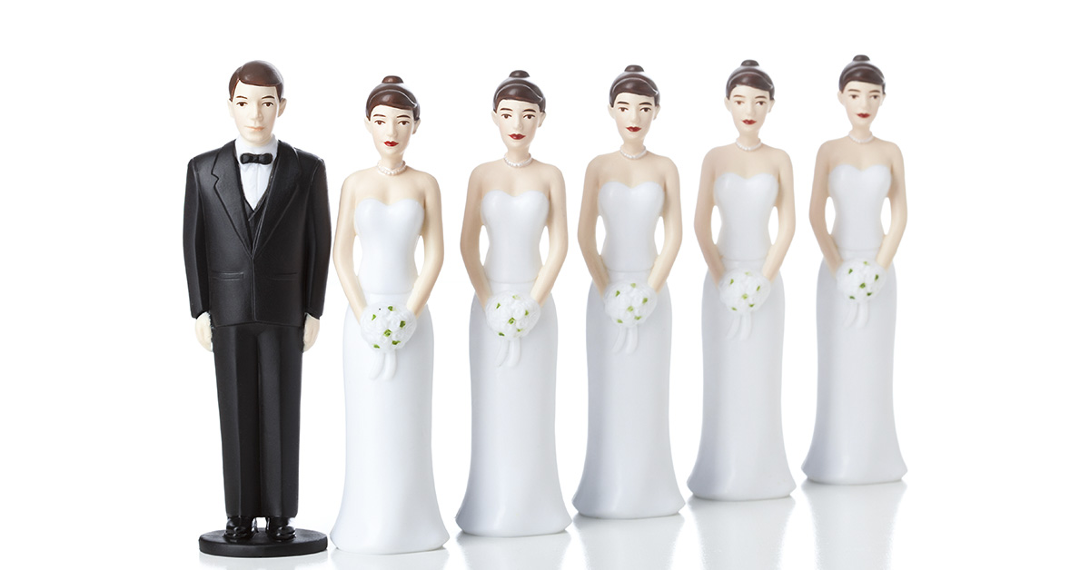 figurines showing a groom and 5 brides to represent polygamy