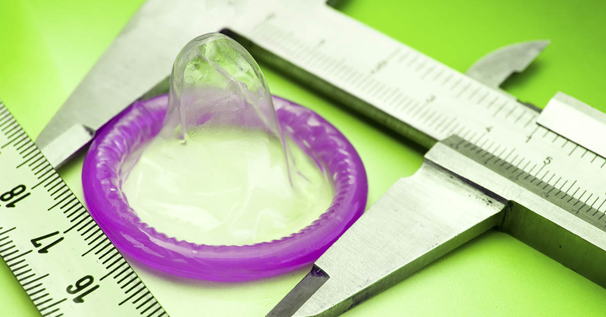 purple condom with measuring device around it