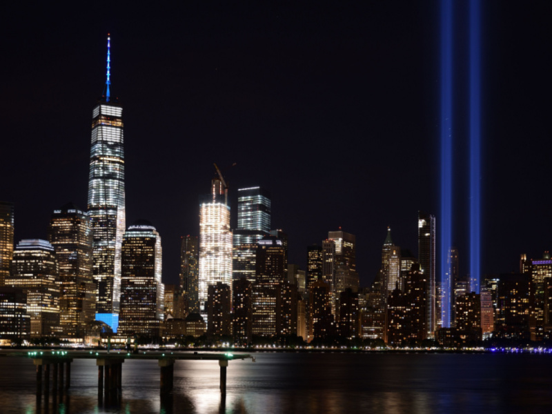  SEPTEMBER 11, 2016: The 9/11 Tribute in Lights temporary monument in lower Manhattan New York City on the 15th anniversary of the terrorist attacks. Wide view from Jersey City