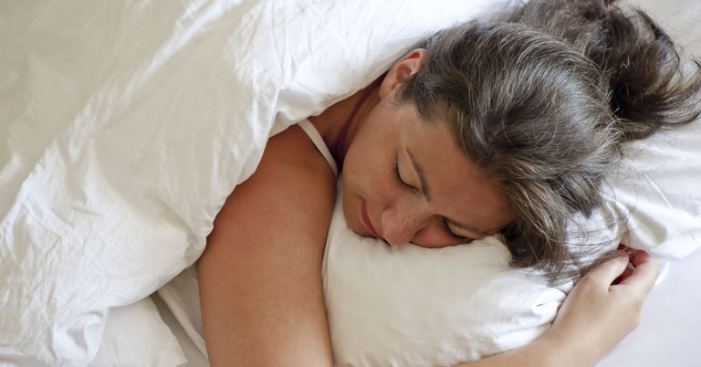 Expert explains why you should never sleep on your front - Featured image