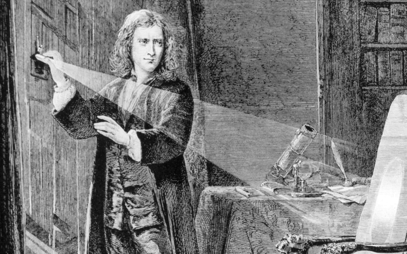 Sir Isaac Newton (1642-1727) examines the nature of light with the aid of a prism
