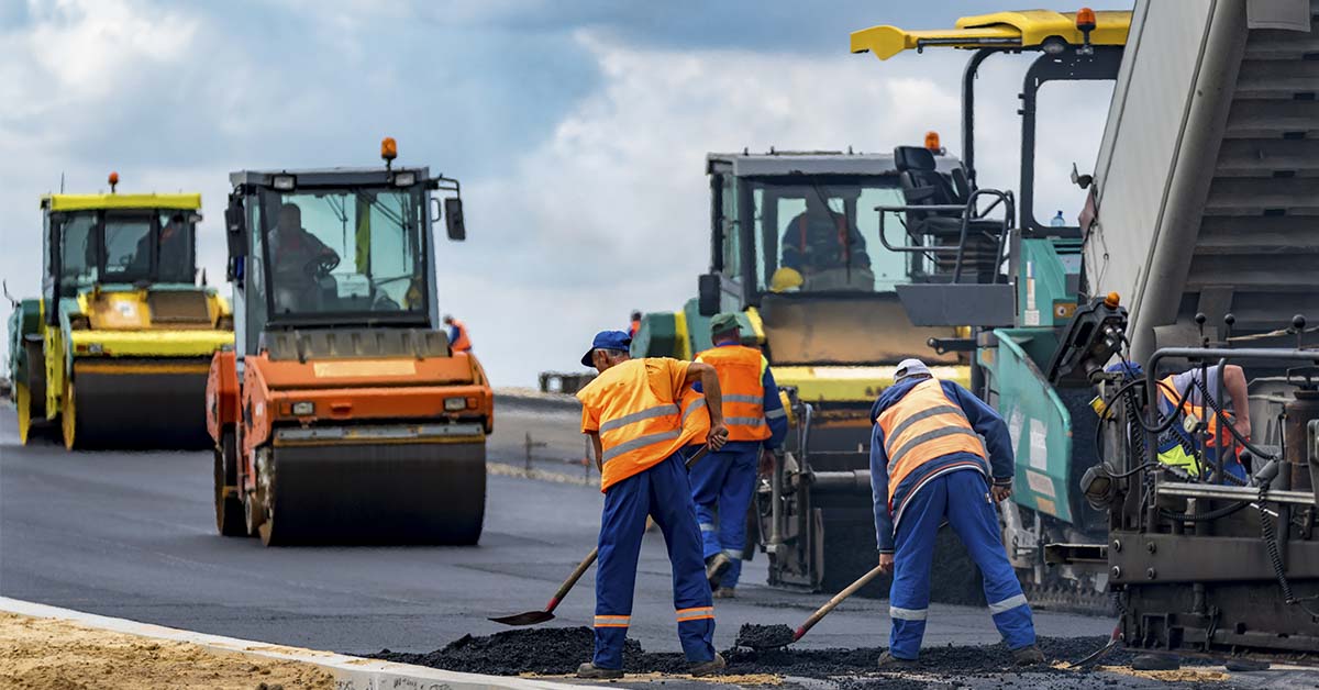 construction crew working on new asphalt road