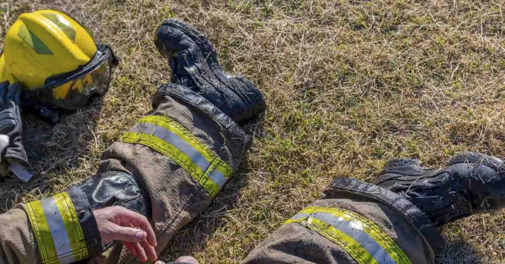 The Photo Of Firefighters Laying Across a Lawn That Went Viral - Featured image