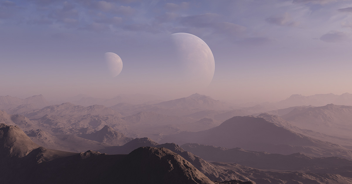 mountainous desert terrain on another planet. Multiple moons can be seen in the sky