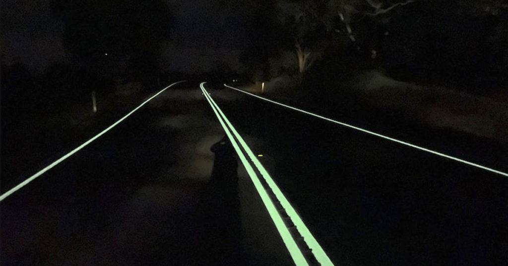 Glow-in-the-dark roads trialled to reduce road toll, protect wildlife