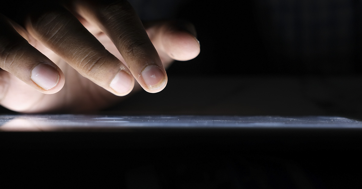 close up, fingers interacting with tablet