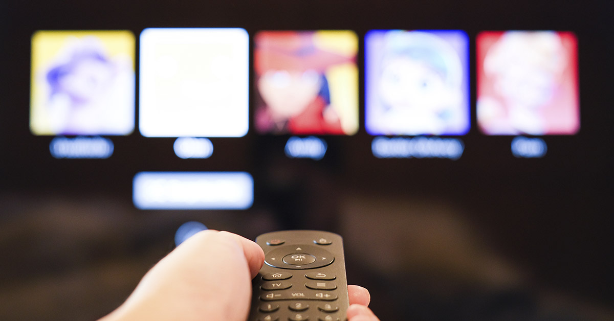 remote control pointed at TV displaying Netflix