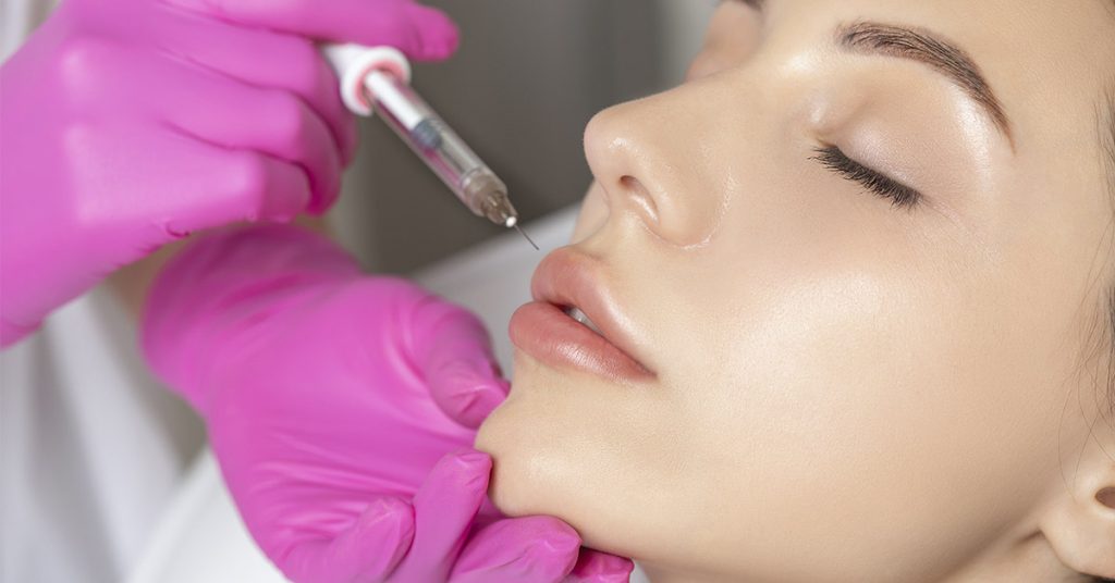 Woman’s Lips Ballooned To Triple Their Size After Apparent Allergic Reaction To Cheap Fillers - Featured image