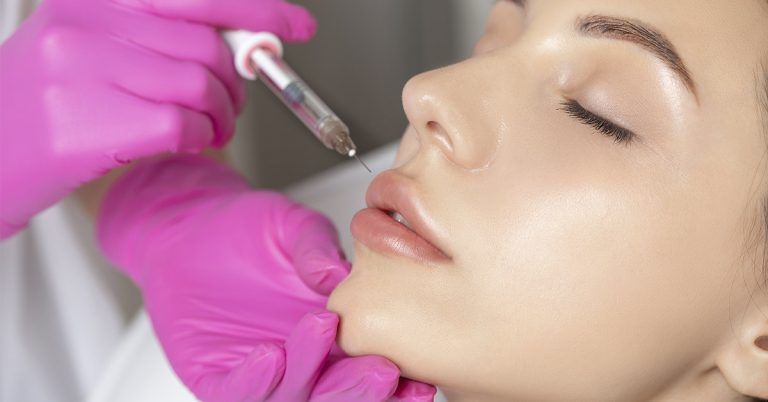 Woman’s Lips Ballooned To Triple Their Size After Apparent Allergic Reaction To Cheap Fillers - Featured image