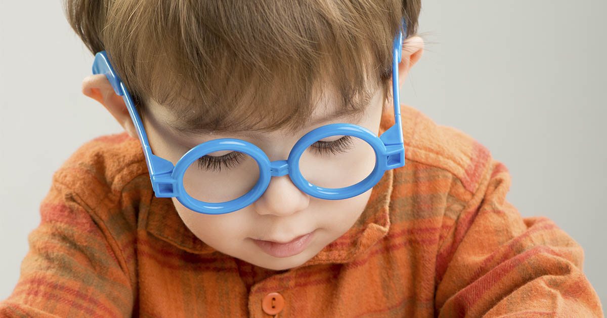 toddler with blue glasses