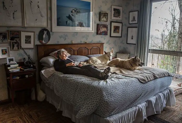 Lucinda, Age 88 with her dogs on the bed