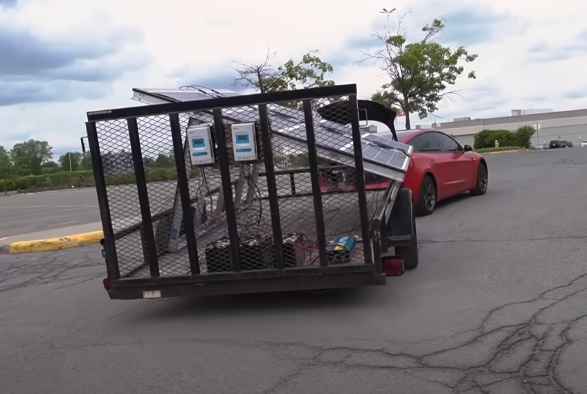 Tesla owner ItsYaBoi driving his Tesla with the trailer hooked up