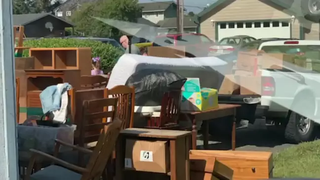 The squatters' furniture on his mom's house's lawn
