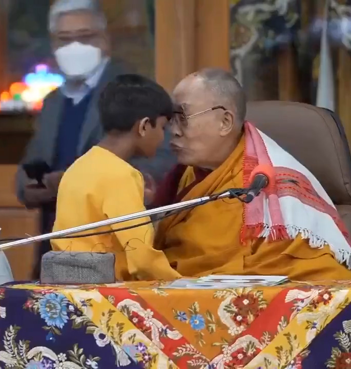 The Dalai Lama with a young boy
