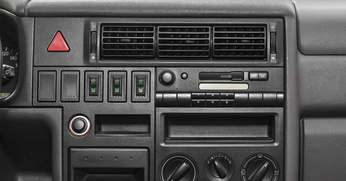 dashboard in older car with more physical controls