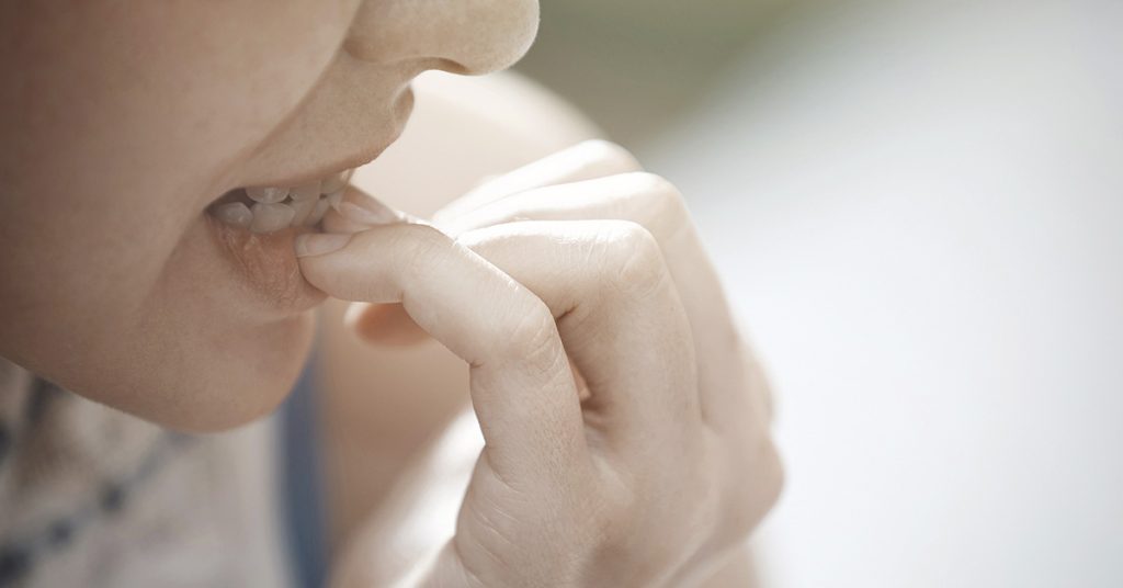 The Psychology Behind Nail Biting - Featured image