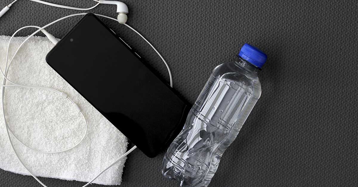 smartphone beside a bottle of water