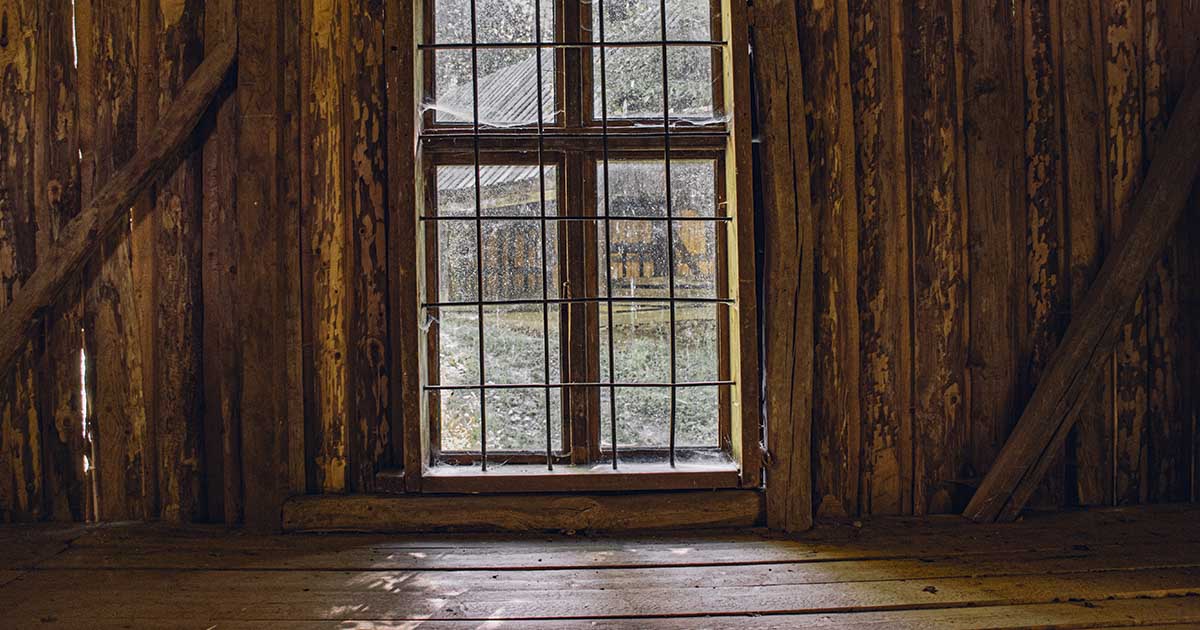 window inside wooden cabin