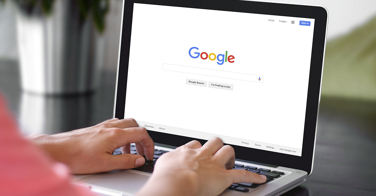 woman browsing google search on laptop