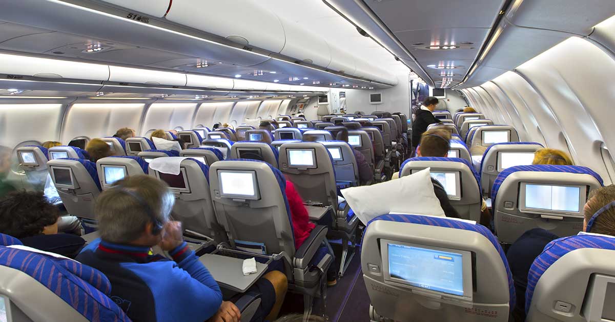 airline cabin with people in their seats