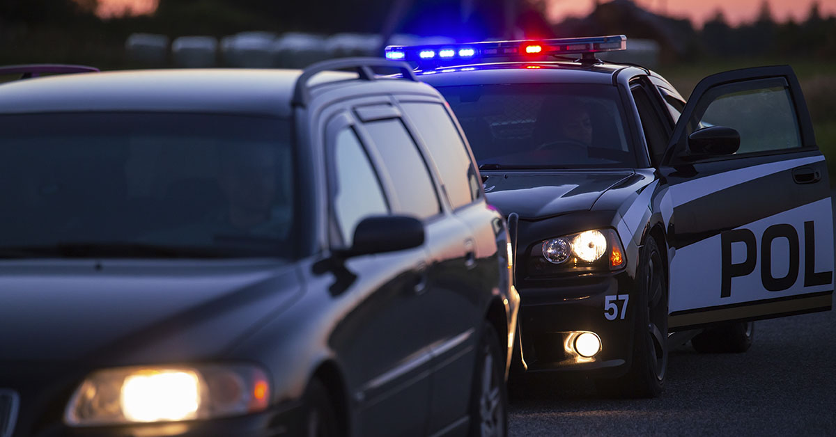 car pulled over with police car behind it