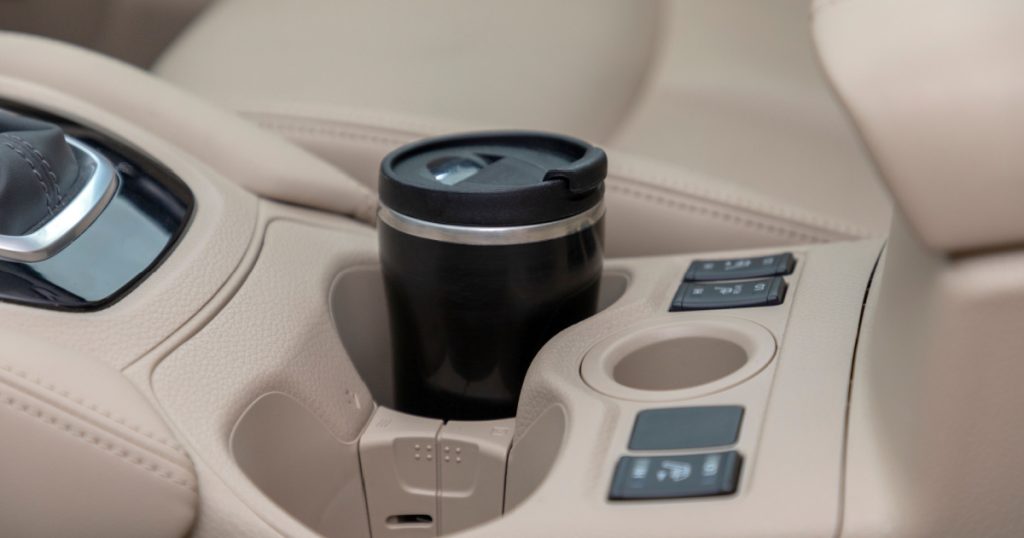 car in cup holder coffee cup, modern car interior
