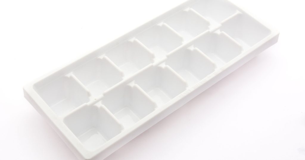 Plastic tray for producing square ice cubes
