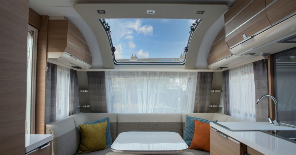 indoor of new expensive caravan with big roof window
