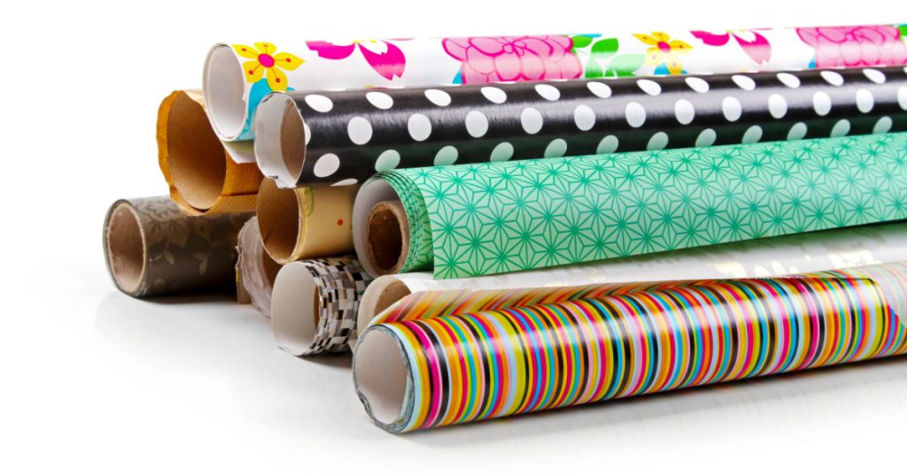 rolls of colorful wrapping paper isolated on white
