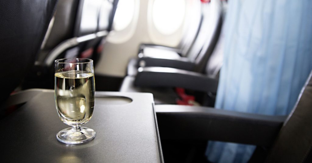 photo of glass of wine in the plane
