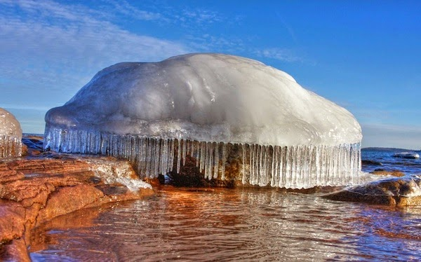 Frozen ice over a rock