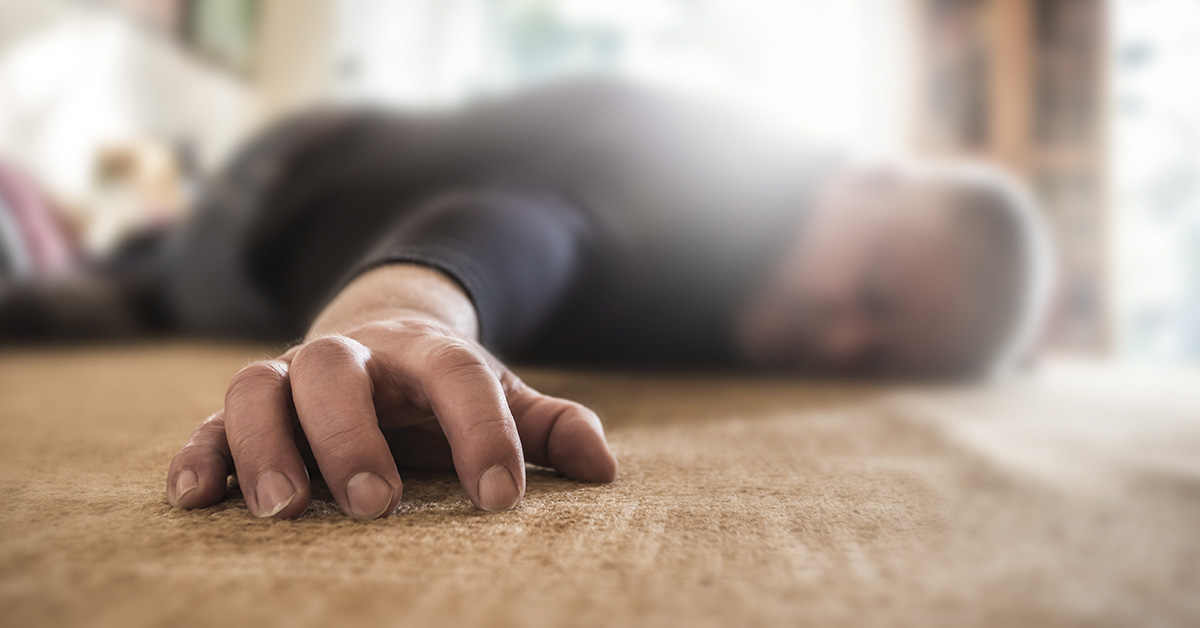 man lying on the floor face down