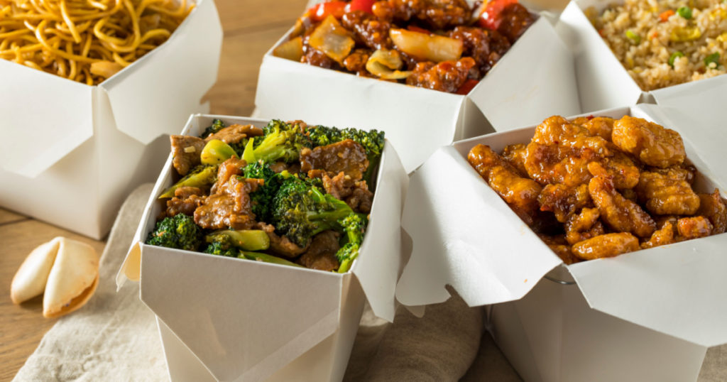 Spicy Chinese Take Out Food with Chopsticks and Fortune Cookies
