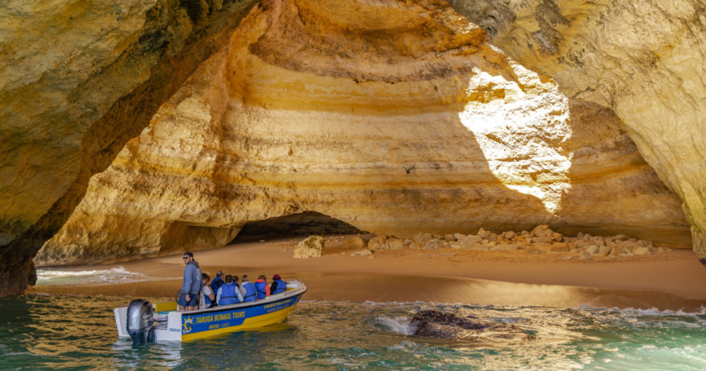 Albufeira , Portugal - January 4th, 2020 : Tourist boat in Benagil Cave in Carvoeiro Algarve Portugal