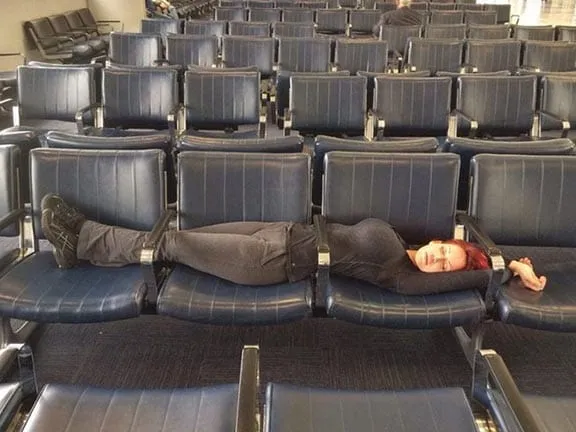 Woman napping at airport