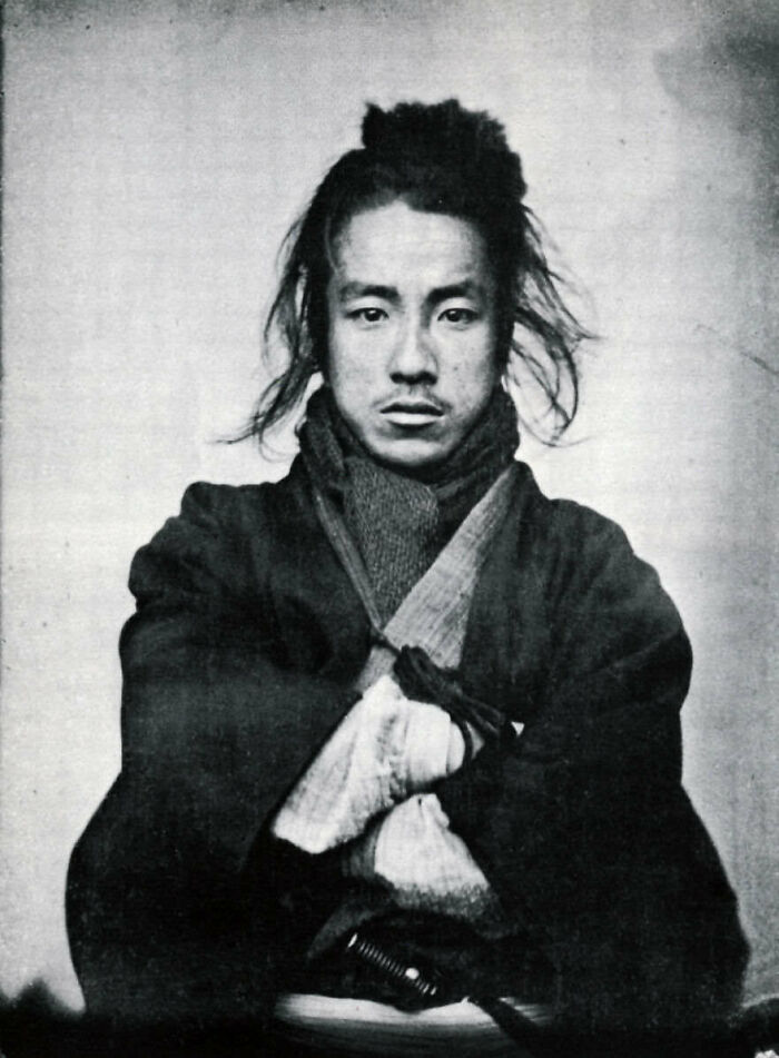 A Japanese samurai, captured in a poignant image from the waning days of the Tokugawa Shogunate around 1865