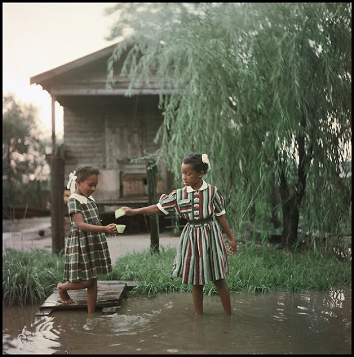 Two children playing alongside a riverbank in Alabama, 1956