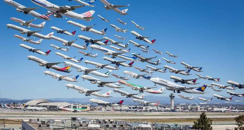 Airplanes taking off from airport.