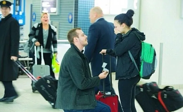 Marriage proposal airport moment
