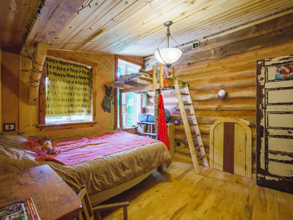 Her daughter's bedroom has a mini loft.   